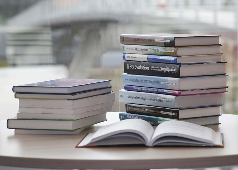 Pile of books on a desk