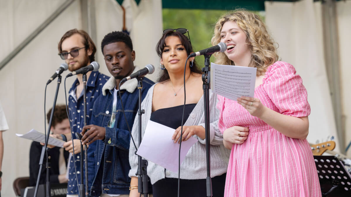 Four performers on stage at Community Festival 2024