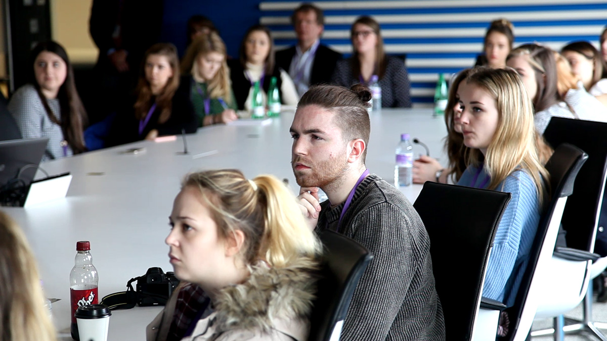 Group of people paying attention to a talk