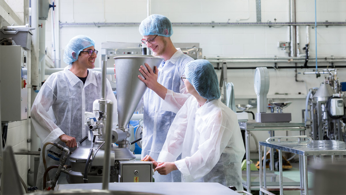 Three students in food bio laboratory