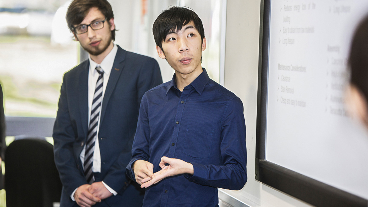 Two students presenting their work