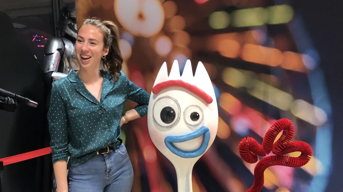Alicia Harding posing next to disney character 'sporky'