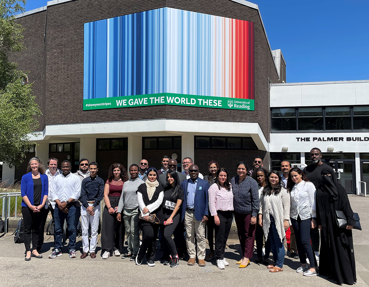 Economics students pose in front of the Palmer Building at the University of Reading