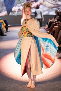 Warming stripes-inspired clothing being modelled at the London Fashion Week launch of the Tammam x University of Reading eco-friendly range