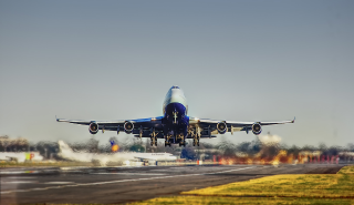 Plane on a runway taking off