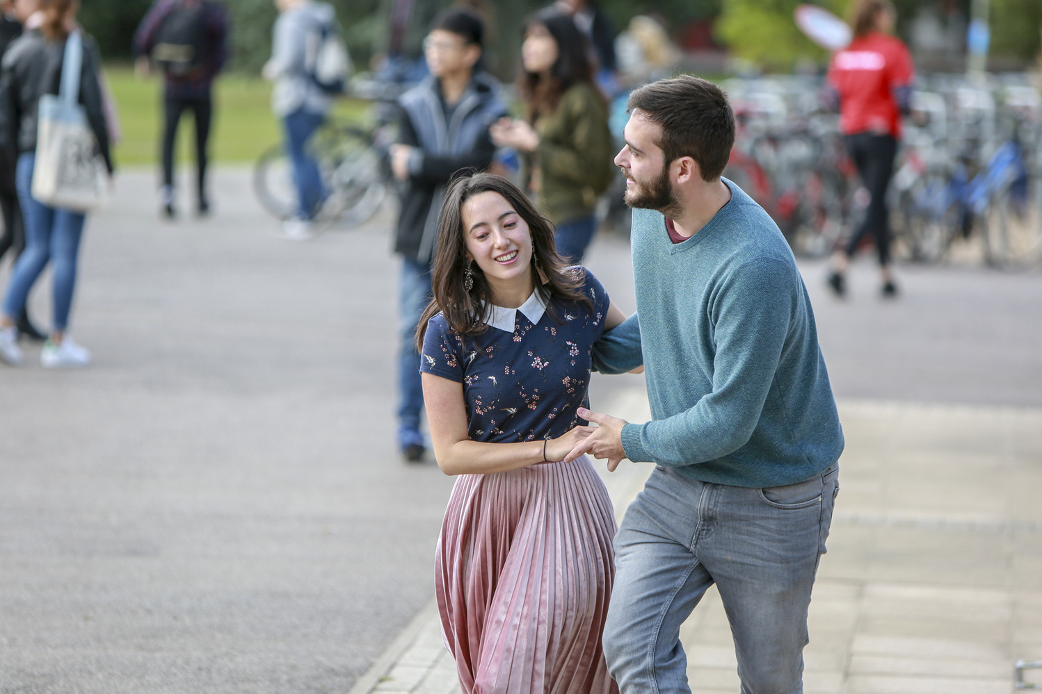 two students dancing lindy hop on the quad