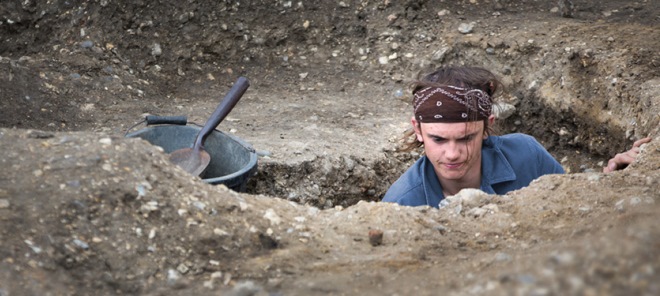 Student working on an archaeological dig