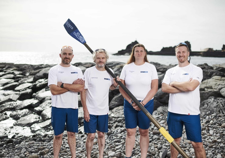 The Heads Together and Row team on a beach.