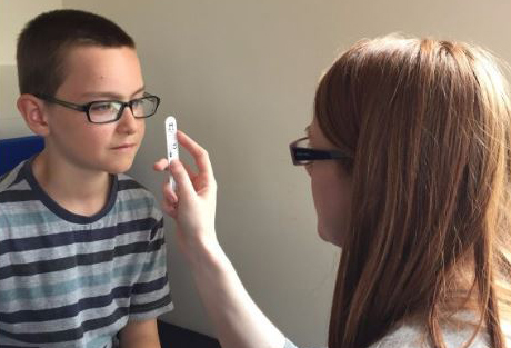 A child has his eyesight assessed