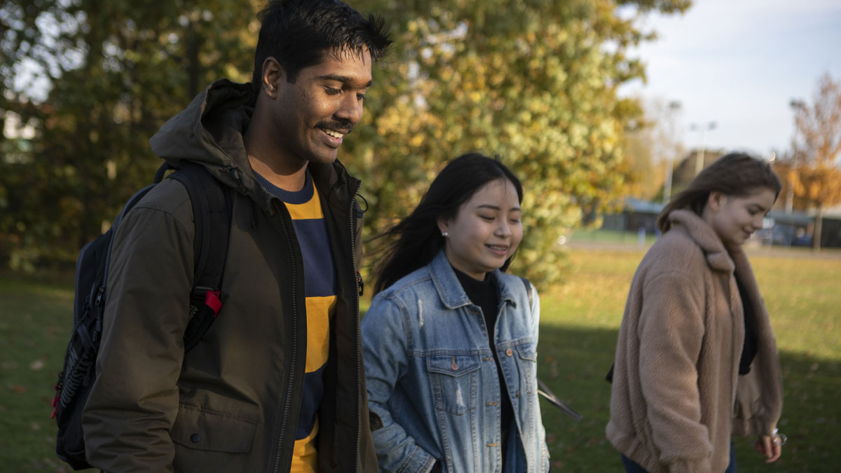 Group of students walking on a field