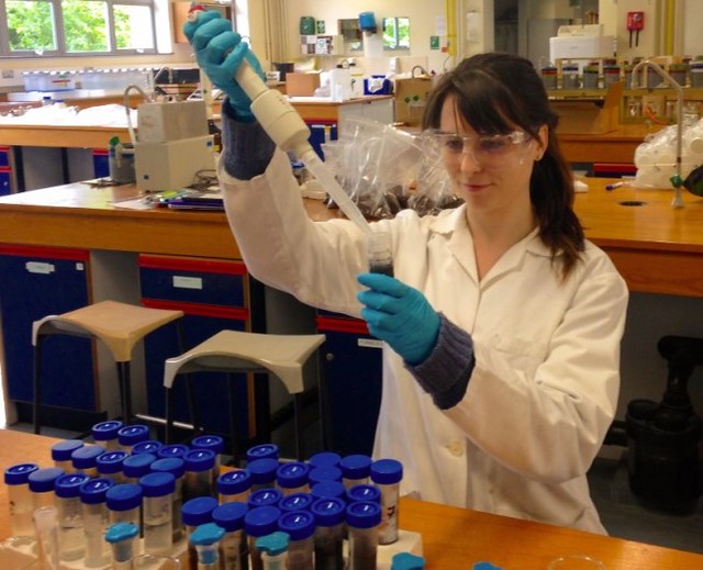 Student carrying out scientific experiment